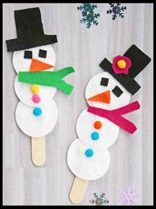 Kids assemble snowman craft project at their christmas party in Bronx ny
