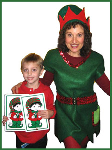Boy poses for picture with elf character at magic show in Bronx NY
