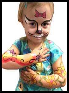 Birthday girl gets both arms and face painted by performer Daisy Doodle at her kids party in NJ