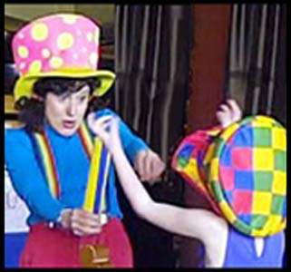 Child helps entertainer Daisy Doodle perform a  magic trick at her birthday party in Westchester NY