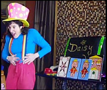 Clown magician Daisy Doodle performing a comedy clown magic show with storytelling and magic props Westchester NY