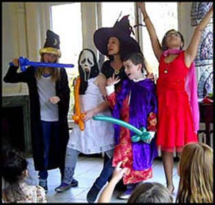 Kids pose in costume after participating in Harry Potter magic show at birthday party Brooklyn NYC