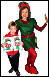 Daisy Doodle dressed as Christmas elf with boy volunteer at kids Christmas holiday magic party in New Jersey