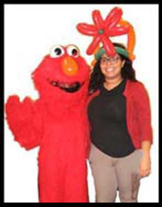 Friends sent Elmo character singing telegram to lady for birthday entertainment Westchester NY
