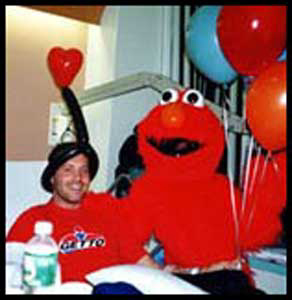Elmo character entertains man in hospital with birthday singing telegram Bronx NYC