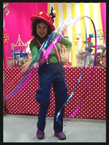 Entertainer Daisy Doodle's opening number with colorful props and music at 3 year old toddler birthday party Bronx NYC