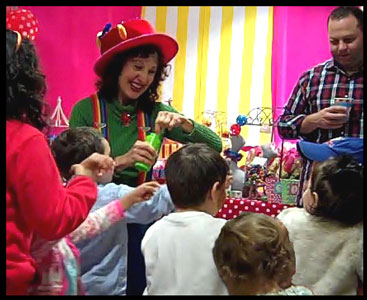 Performer Daisy Doodle blows bubbles for toddler entertainment at birthday party Westchester NY