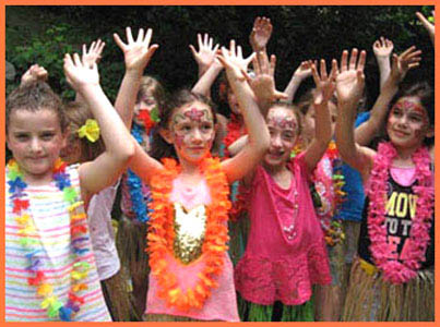 Girls learning to hula dance at Hawaiian party Long Island NY