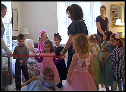 Children wait in line to dance the limbo at birthday party in Connecticut