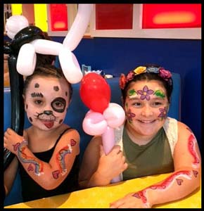 Children get facepainting and body paint plus balloon animals at restaurant in Manhattan NYC