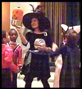 Children awed by pumpkin produced by magician Daisy Doodle at their  Halloween party magic show Manhattan NYC