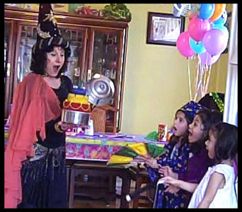 KKids are awed when wizard magician Daisy Doodle makes birthday cake appear as finale to wizard magic show Jersey City NJ